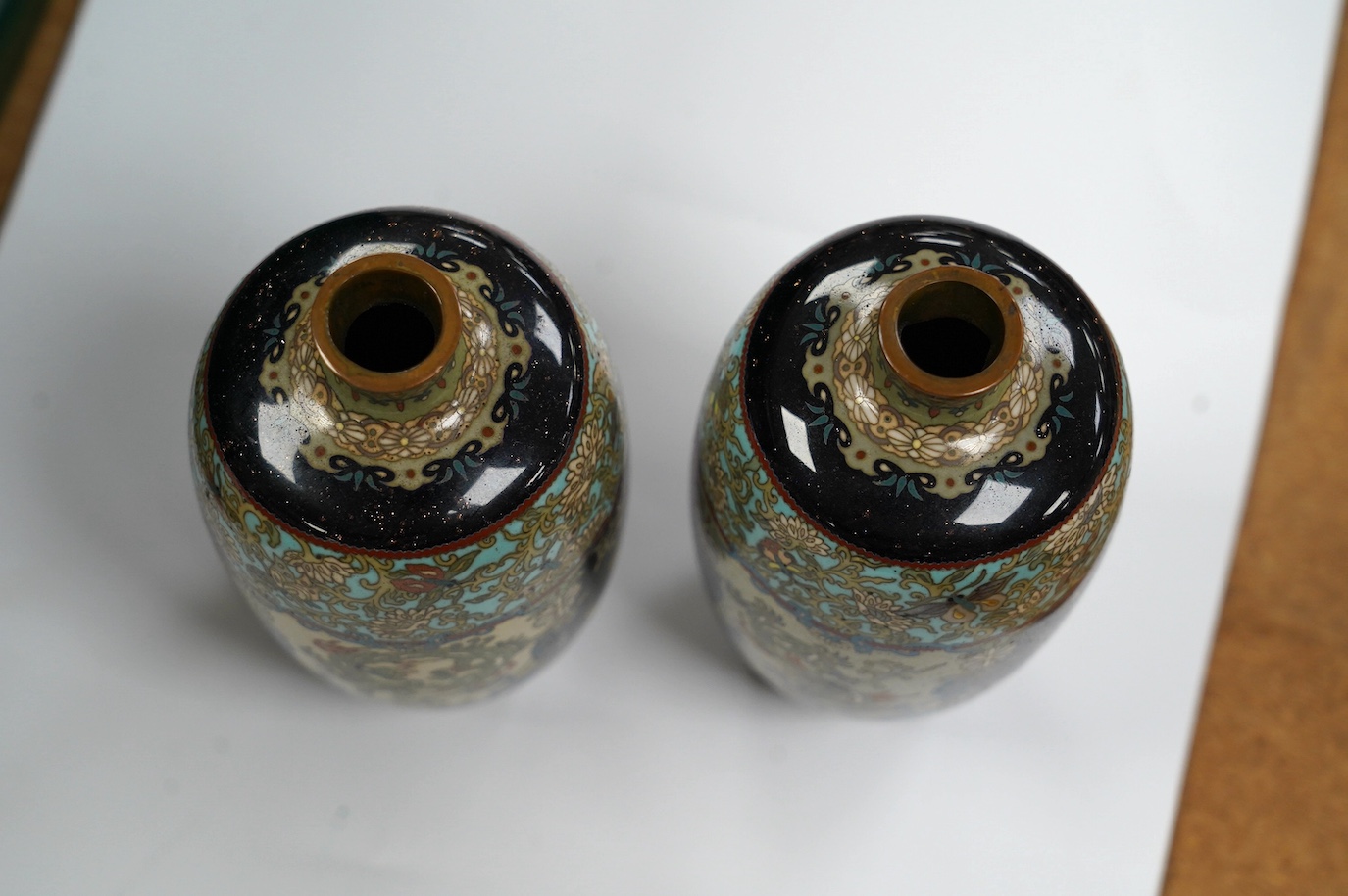 A pair of Japanese cloisonné enamel vases, signed, 14.5cm high. Condition - fair to good